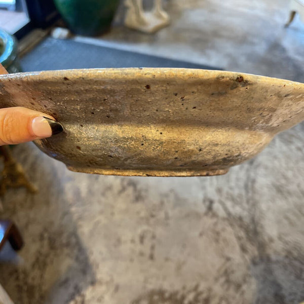 Pottery bowl with ram at sides