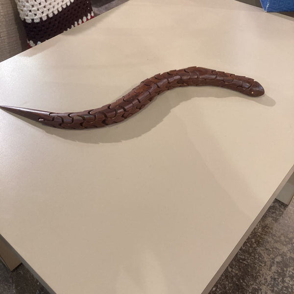 Artist signed rosewood articulated snake (21"L, 1"W)