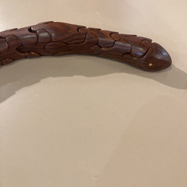 Artist signed rosewood articulated snake (21"L, 1"W)