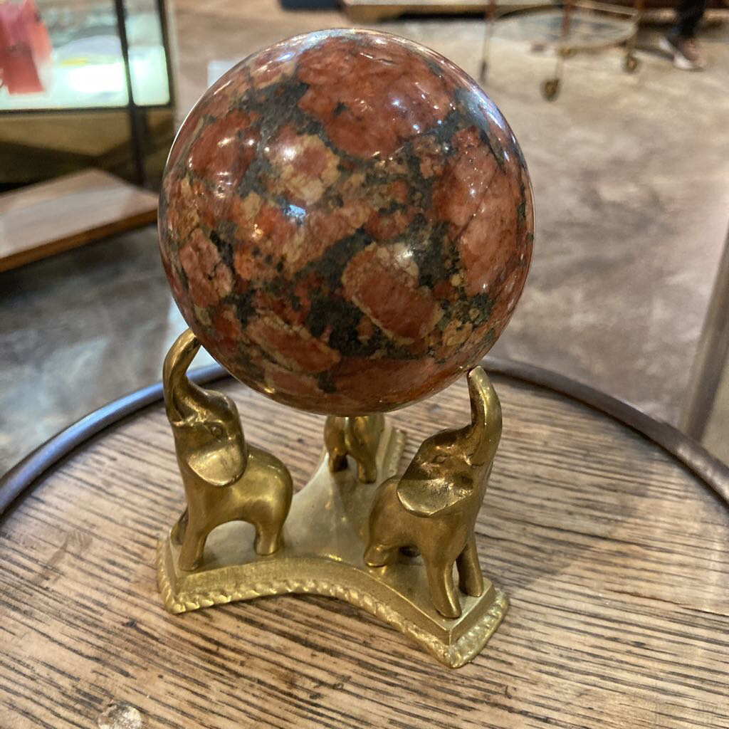 Natural travertine orb on brass elephant stand (5.5"h, 3.5"w)