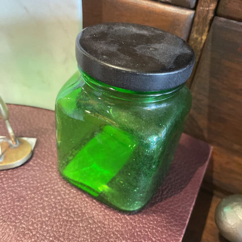 Green glass jar with lid