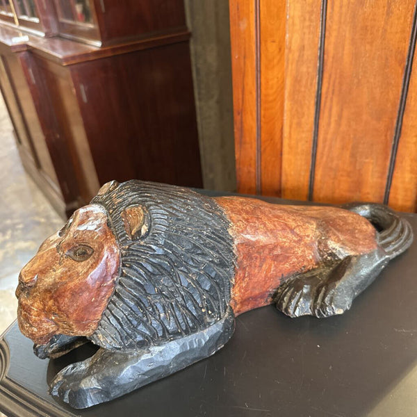 Carved wood Lion lying down 18in