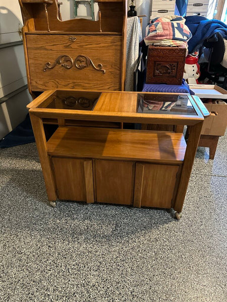 MCM solid walnut rolling bar/serving cart with smoked glass inserts- date stamp 1958 on bottom . For pick up only approx 42x30.75x18