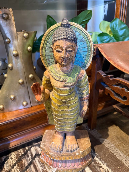 Tall goddess statue carved of wood