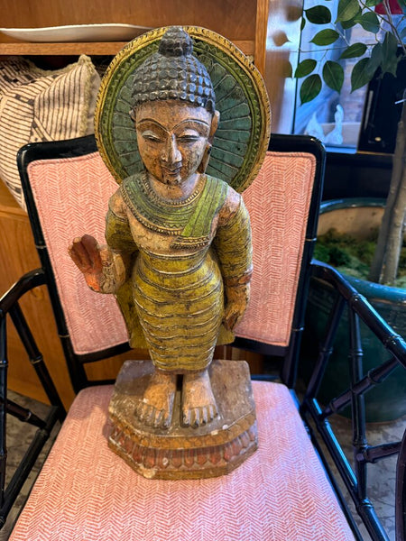 Tall goddess statue carved of wood