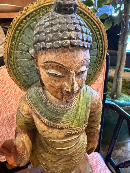 Tall goddess statue carved of wood