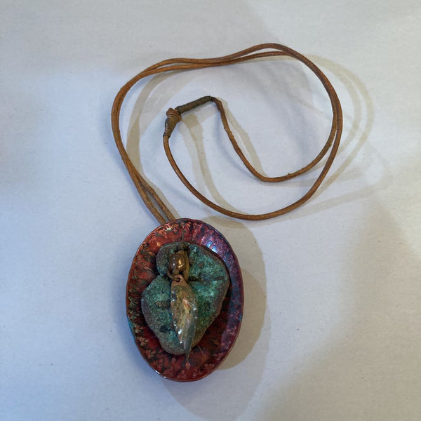 Vintage oval copper pendant with feather on leather (1.5x2.5 in)