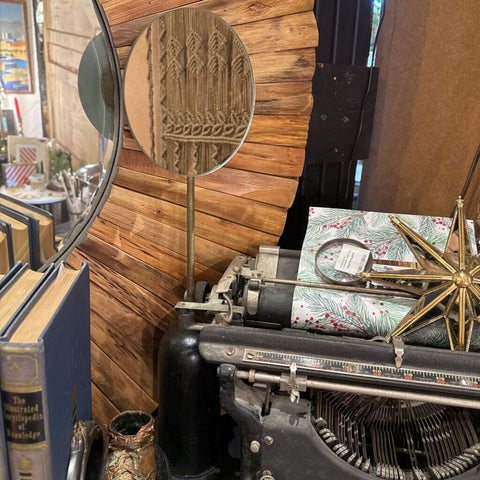 Shaving mirror on wooden stand