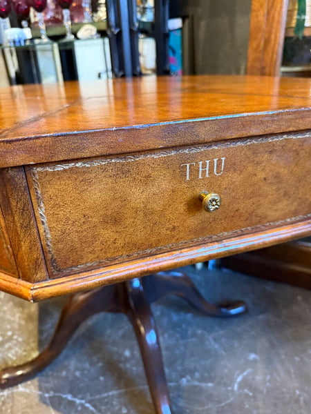 Leather topped side table with drawers lined in marbled paper and labeled by day 31S 27T