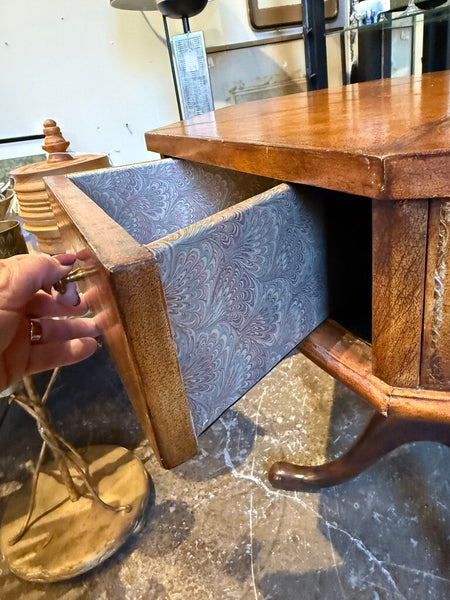 Leather topped side table with drawers lined in marbled paper and labeled by day 31S 27T