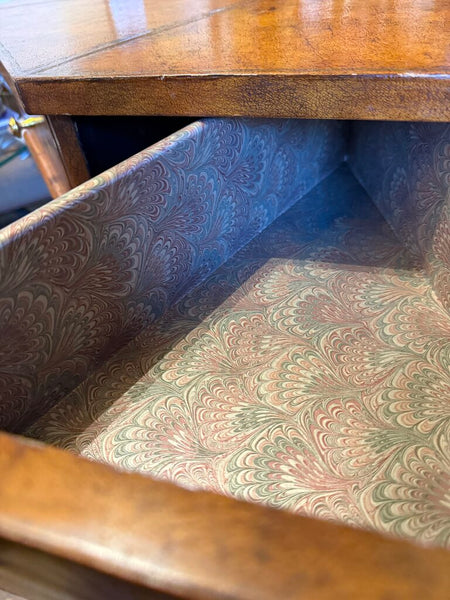 Leather topped side table with drawers lined in marbled paper and labeled by day 31S 27T