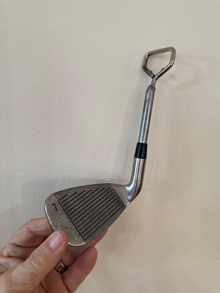 Vintage golf club repurposed as bottle opener