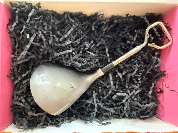 Vintage golf club repurposed as bottle opener