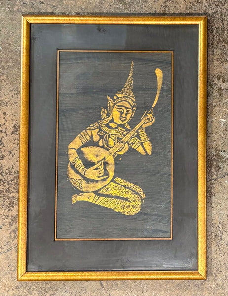 MID CENTURY THAI TEMPLE RUBBING ART OF MUSICIAN IN GILDED FRAME, MATTED & UNDER GLASS | 23.25"H X 16.25" W