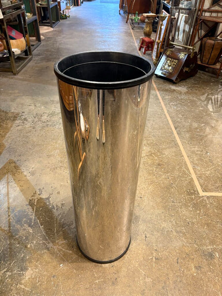 Postmodern cylindrical chrome clad planter as found