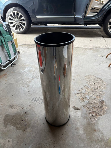 Postmodern cylindrical chrome clad planter as found