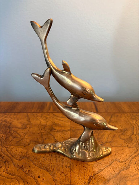 Brass double dolphin figure