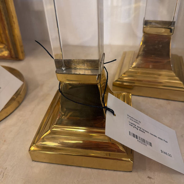 Lucite and brass candle stick Pair varying sizes