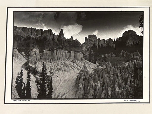 WHEELER MONUMENT PHOTOGRAPH HAND SIGNED BY JON THOMPSON, FRAMED AND UNDER GLASS | 14.25"W X 11.25" H