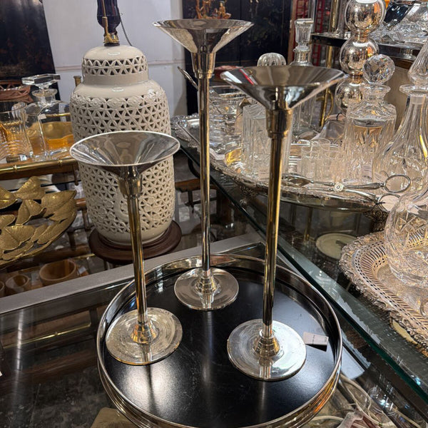 Set of three silver plated candle holders varying sizes