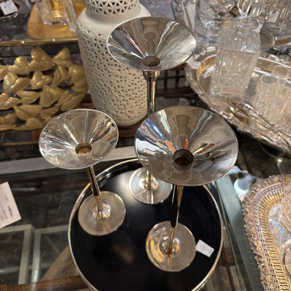 Set of three silver plated candle holders varying sizes