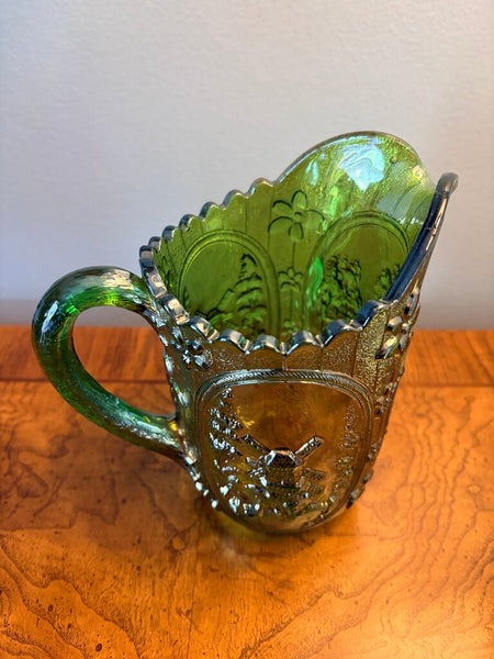 Green windmill carnival glass pitcher