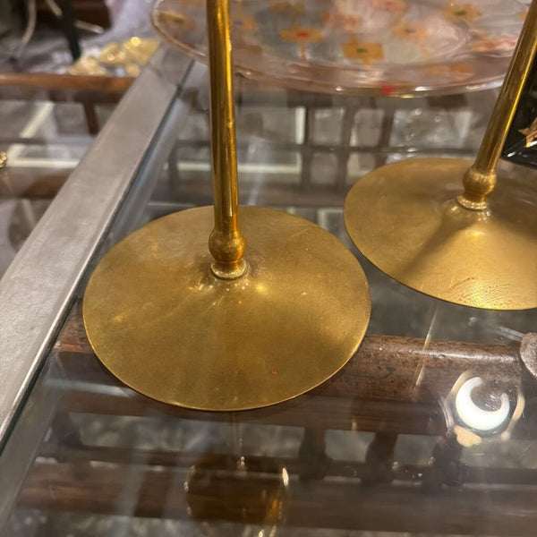 Pair of brass candle sticks with floral top