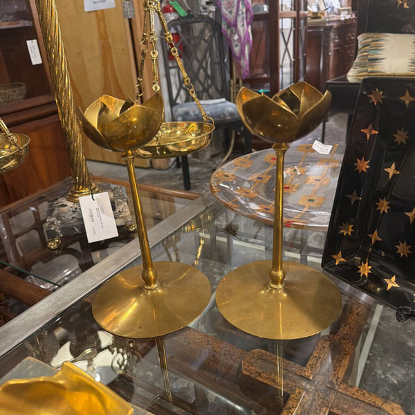 Pair of brass candle sticks with floral top