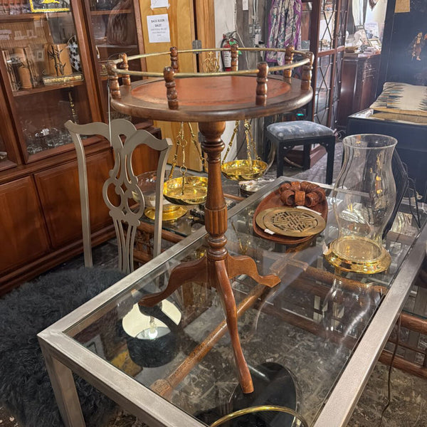 Vintage small round table, orange leather top with brass gallery surround