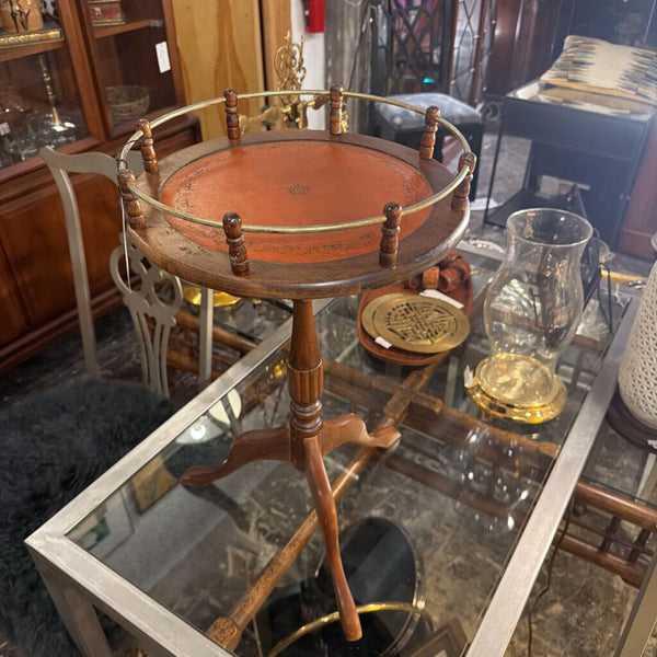 Vintage small round table, orange leather top with brass gallery surround