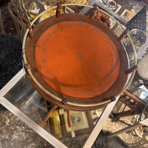 Vintage small round table, orange leather top with brass gallery surround