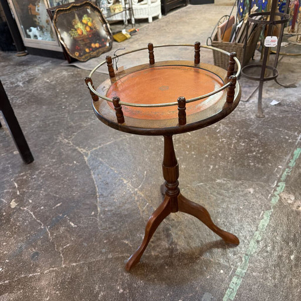 Vintage small round table, orange leather top with brass gallery surround