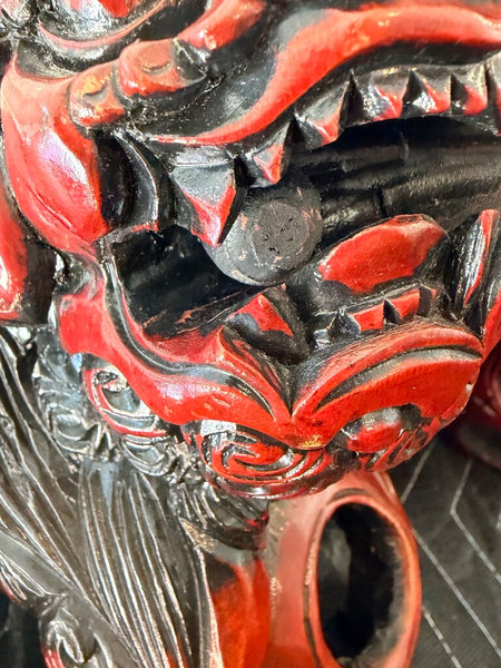 Matching pair of carved food dogs with double trapped balls, approximately 10 inches tall by 12 inches long