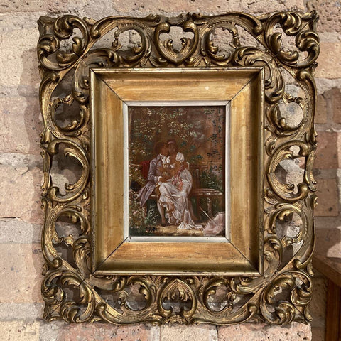 Antique framed oil of man & woman (10"h x 11"w)