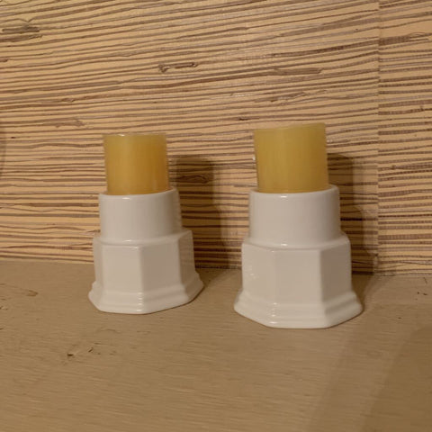 Set of Vintage White Pillar Candleholders with yellow candles